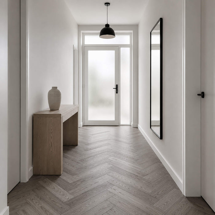 Alsace Oak Rigid LVT Herringbone flooring in a home hallway setting.