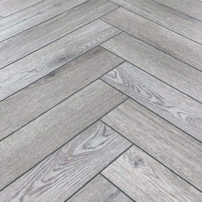 Close-up of Alsace Oak Rigid LVT Herringbone Flooring