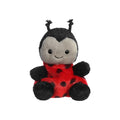 A ladybug stuffed animal resting on a plain white background, showcasing its bright red and black features.