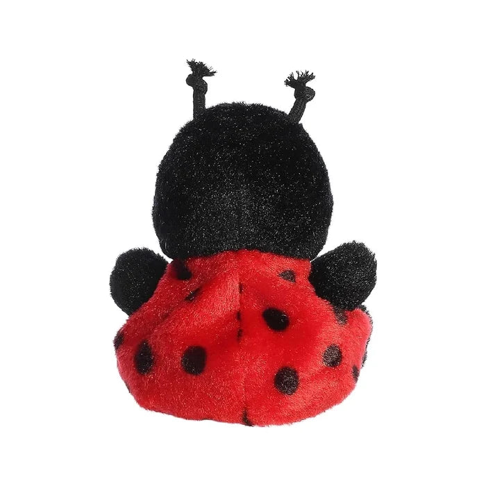 A cute ladybug stuffed animal on a white background, illustrating its friendly appearance and colorful design.