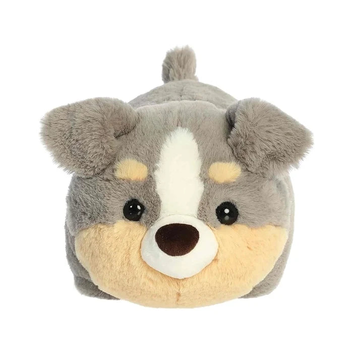 A stuffed animal dog featuring a white face and a brown nose, sitting upright against a neutral background.