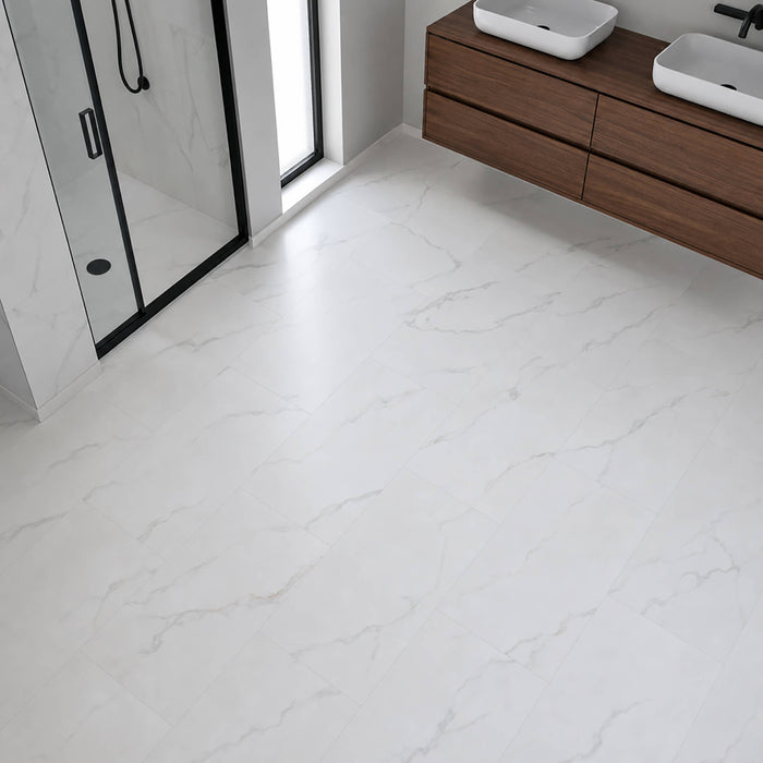 A modern bathroom with Bianco Marble Rigid LVT Flooring with shower and wooden vanity units.
