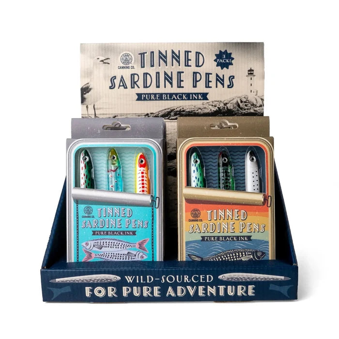 DM Merchandising Bunk House Tinned Sardine Pens featuring three sardine-shaped pens with black ink in novelty tinned-fish packaging.