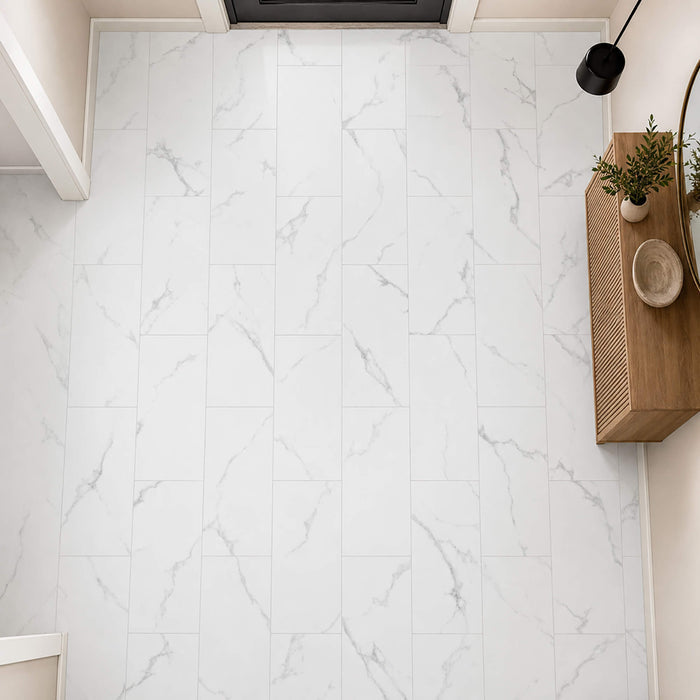 Elevated view of Calacatta Marble Gloss Rigid LVT floor tiles in a hallway setting.