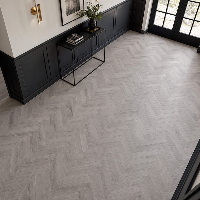 Castle Grey Herringbone laminate flooring in a hallway interior setting.