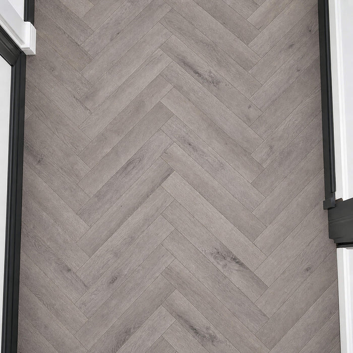 Elevated view of Castle Grey Herringbone laminate flooring.