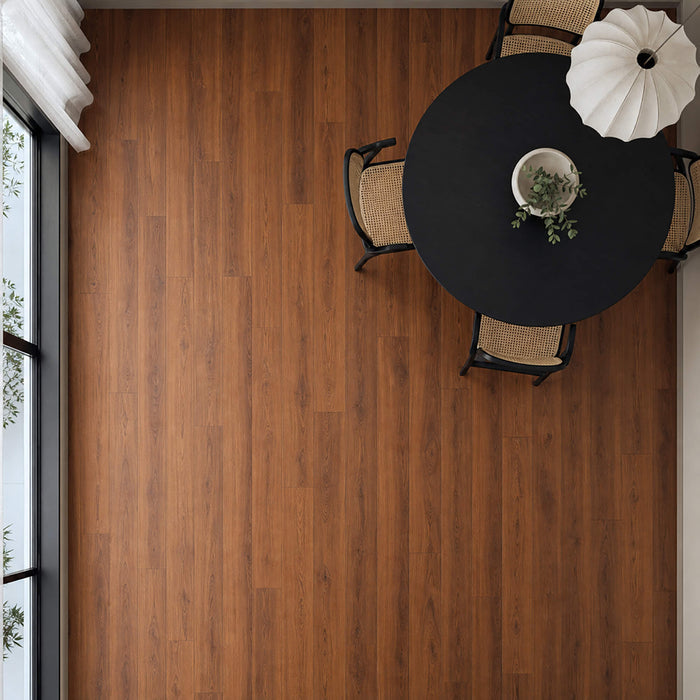 Elevated view of Deep Smoked Oak Prestige laminate flooring in a dining room setting.