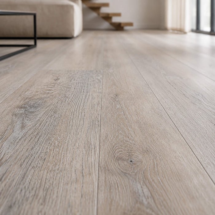 Close-up of Driftwood Oak Rigid LVT flooring in a modern interior setting.