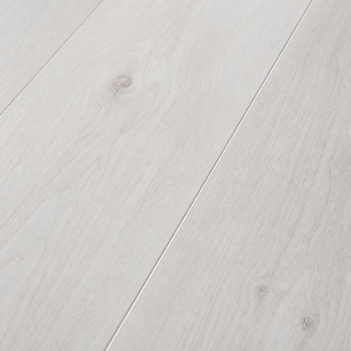 Close-up of the grain and texture of Fresco Snow Gloss laminate flooring.