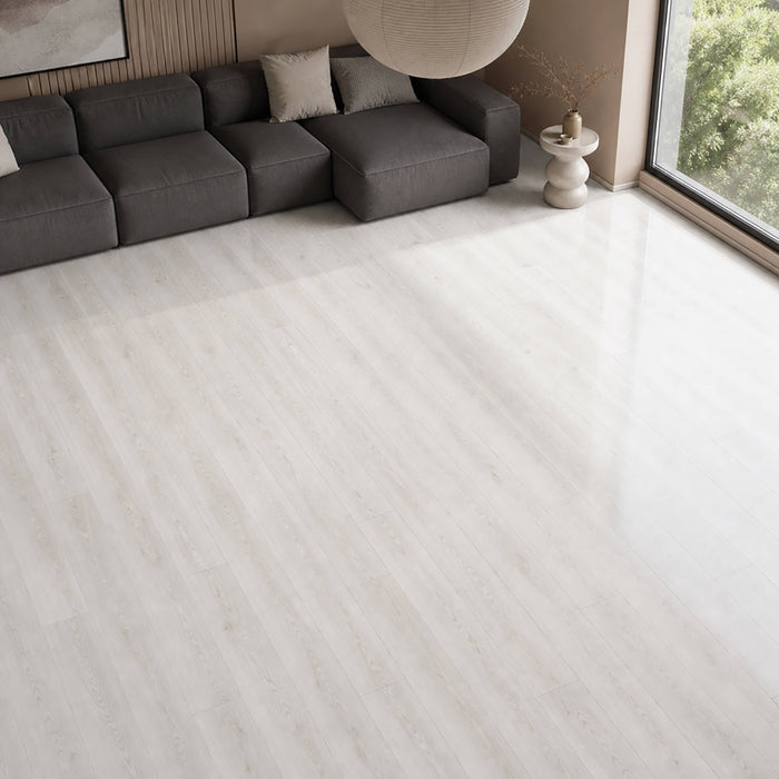 Close-up of Fresco Snow Gloss laminate flooring in a modern living room setting.
