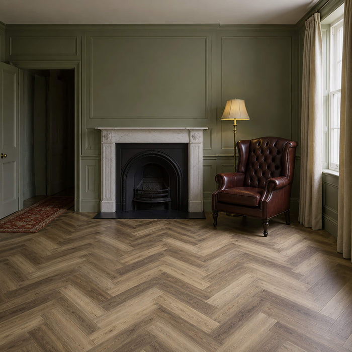 Victorian living  room with Fumed Oak LVT herringbone flooring, a fireplace, leather armchair, and lamp.