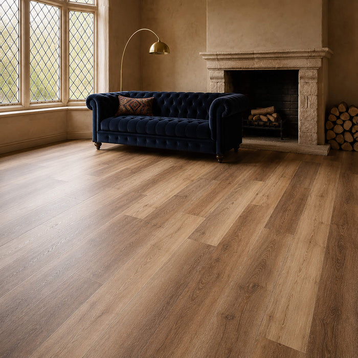 Fumed Oak Rigid LVT flooring in a vintage living room setting with a sofa, lamp and a fireplace.
