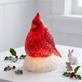 5.5-inch lighted water lantern featuring a red cardinal with swirling glitter