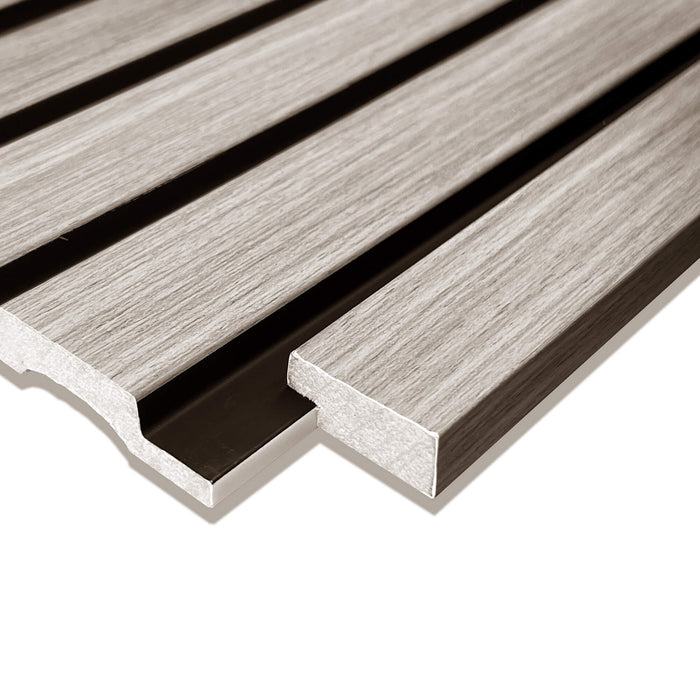 Close-up of a Grey Aqua Slatwall Left Trim being positioned in place on a white background.