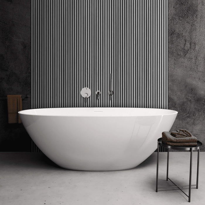 Modern white freestanding bathtub in a bathroom with Grey Aqua Slatwall Panel wall and towel.