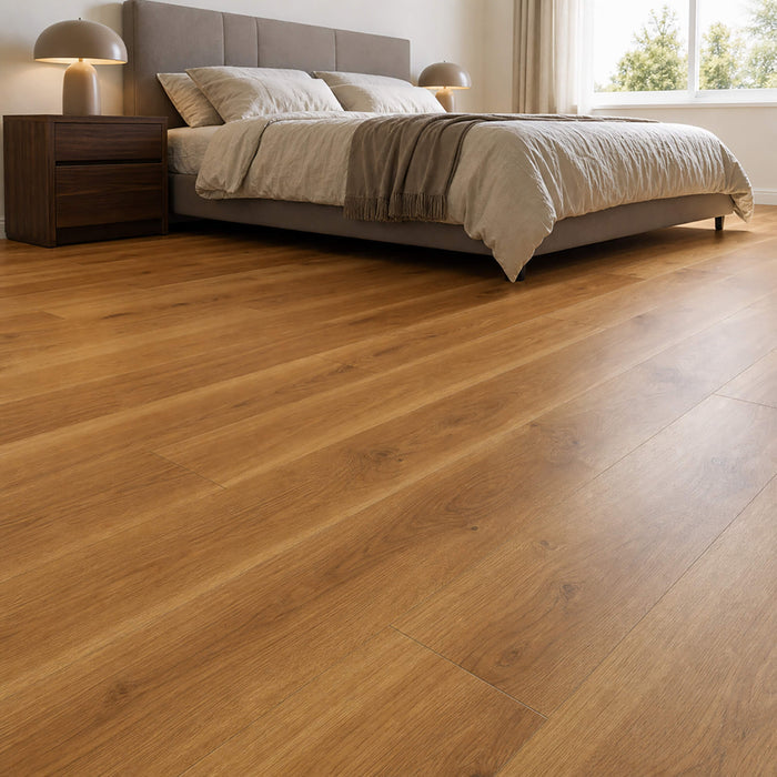 Groovy Oak Country laminate flooring in a bedroom with a bed and nightstands.