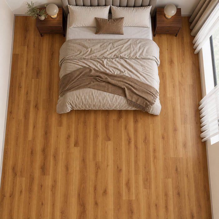 Elevated view of Groovy Oak Country laminate flooring in a bedroom setting.