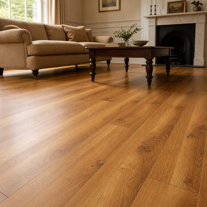 Groovy Oak Prestige laminate flooring in a living room with a couch and coffee table.