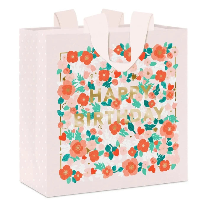 Medium floral birthday gift bag on a white background