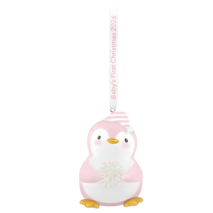 Front view of pink and white penguin ornament with striped cap and textured snowflake
