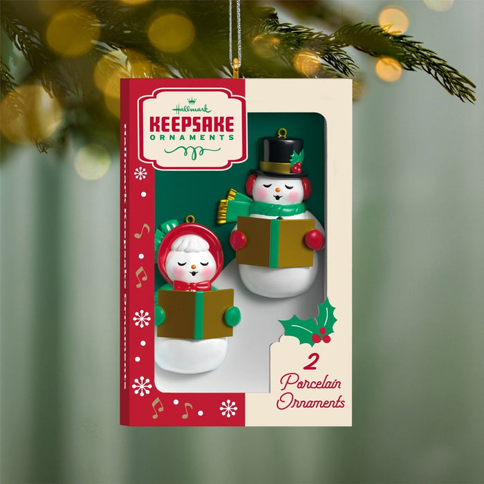 2026 Hallmark Nifty Fifties snowman ornament box with two caroling porcelain figures on pine branch