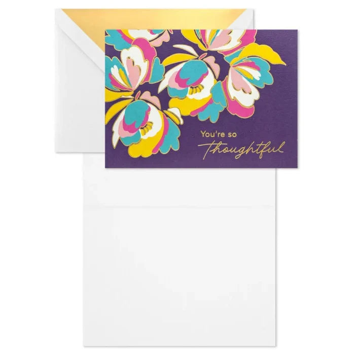 Greeting card with colorful floral design and envelope on a white background