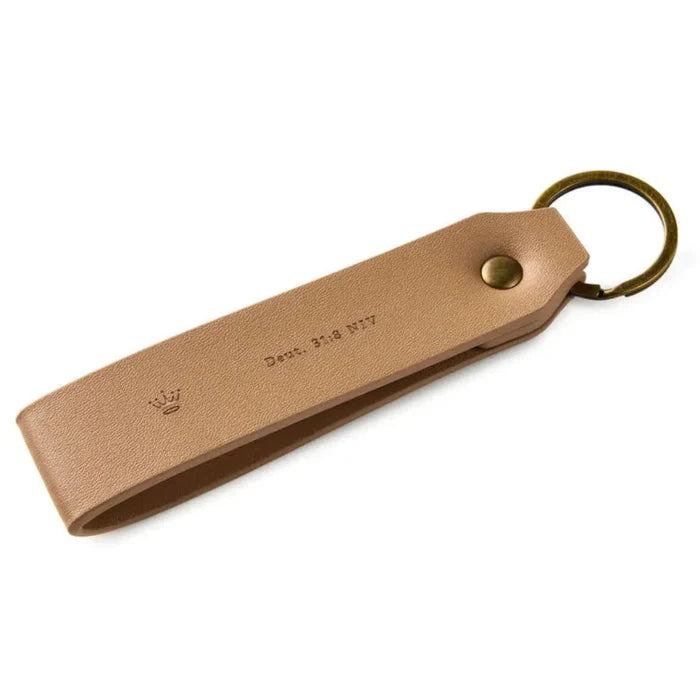 Brown leather keychain with a metal ring on a white background