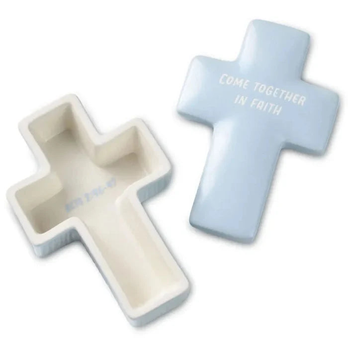 Two cross-shaped containers, one white and one light blue, on a white background.