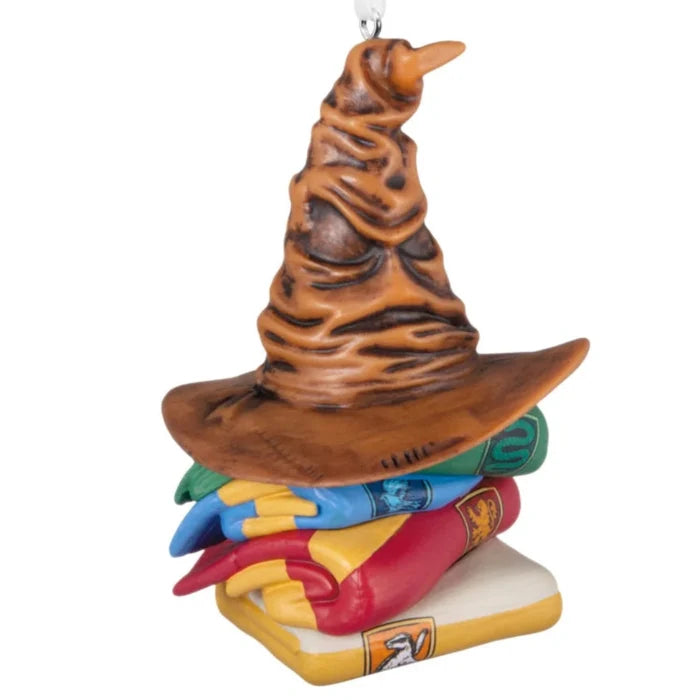 Hallmark Harry Potter Sorting Hat and Hogwarts house scarves ornament featuring the iconic Sorting Hat with Gryffindor, Hufflepuff, Ravenclaw, and Slytherin colors, collectible Christmas tree decoration.