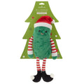 Plush pickle toy with Santa hat and striped scarf on a green tree-shaped card