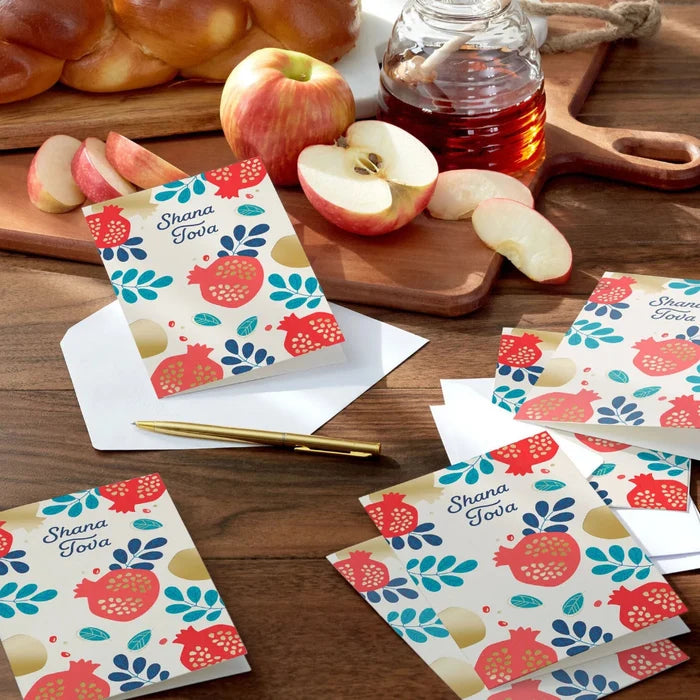 Hallmark Rosh Hashanah greeting cards featuring traditional pomegranate artwork with blue foliage and luxurious gold foil accents.