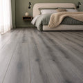 Harbour Oak Country laminate flooring in a modern home bedroom setting.