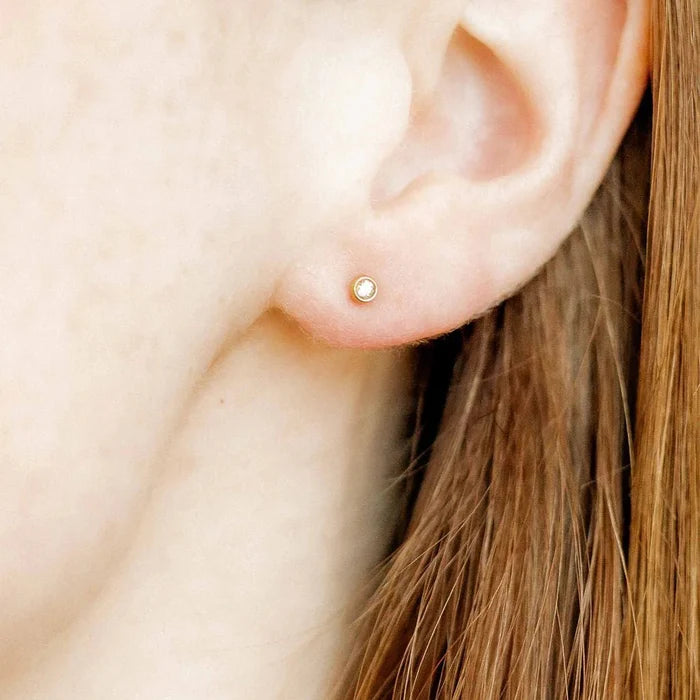 These 2mm clear CZ studs offer the perfect amount of shine in a tiny, minimalist design. Made from 100% surgical-grade stainless steel, these earrings are lightweight, durable, and hypoallergenic, making them ideal for sensitive ears
