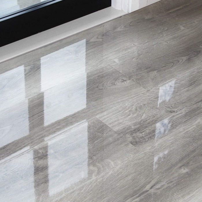 Manhattan Grey Super Gloss Laminate Flooring in a home interior setting