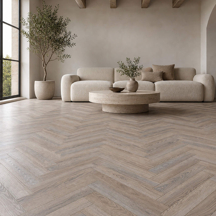 Manor Grey Oak Herringbone laminate flooring in a living room setting.