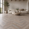 Manor Grey Oak Herringbone laminate flooring in a living room setting.