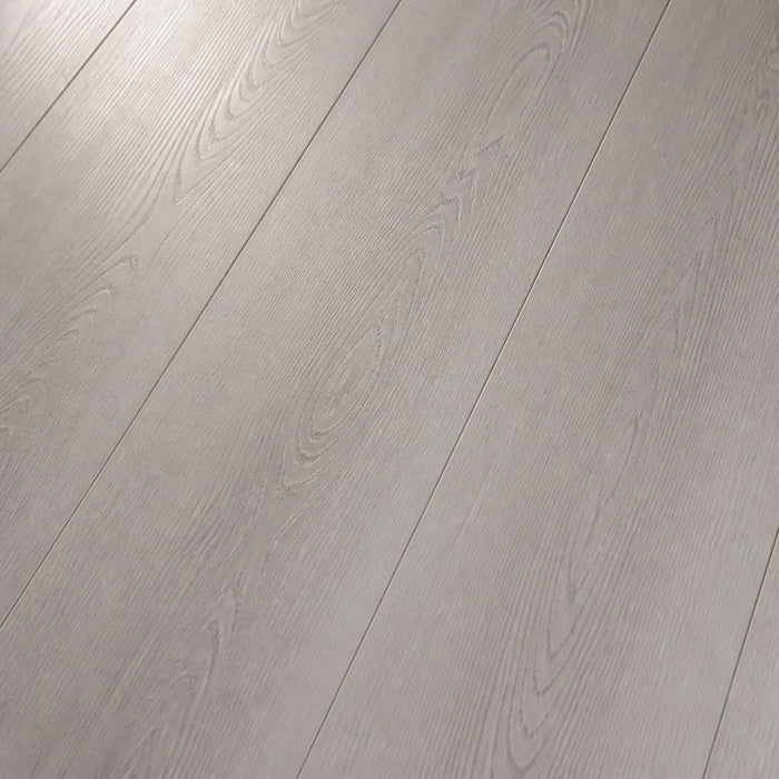 Close-up showing the grain and texture of Misty Grey Prestige Plus laminate flooring.