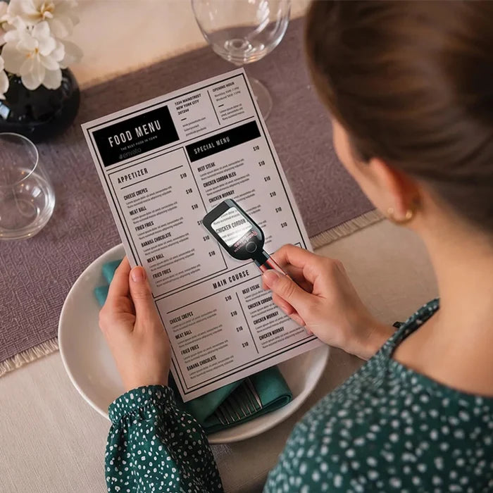 The DM Merchandising Modern Monkey Read Between the Wine Magnifier with Light fits right in your pocket.
