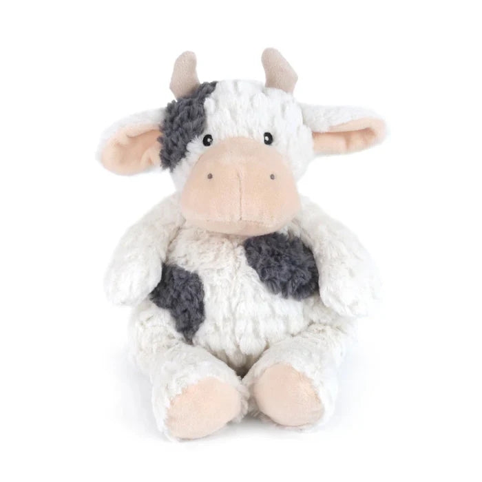 with a heart as big as the barnyard! With her fluffy cream-colored textured coat, soft pink snout, and adorably lopsided dark patches