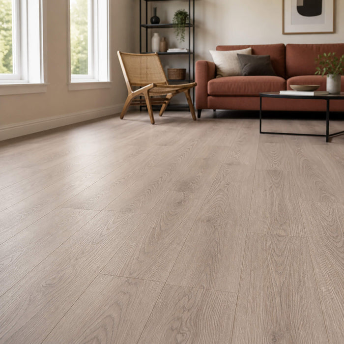 Living room with Mushroom Carpenter Oak laminate flooring, sofa, and decorative accessories.