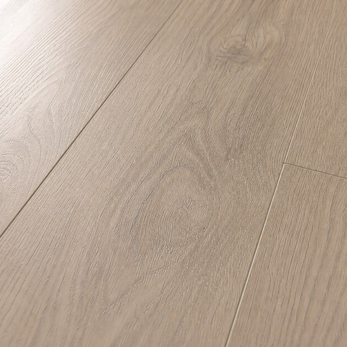 Close-up of the grain and texture of Mushroom Carpenter Oak laminate flooring.