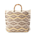 Woven tote bag featuring a geometric pattern with gold accents, showcasing a stylish and modern design.