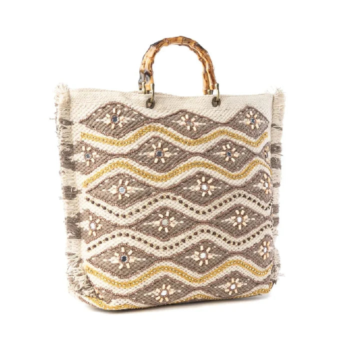 Stylish woven tote bag adorned with geometric shapes and gold accents, perfect for casual outings.