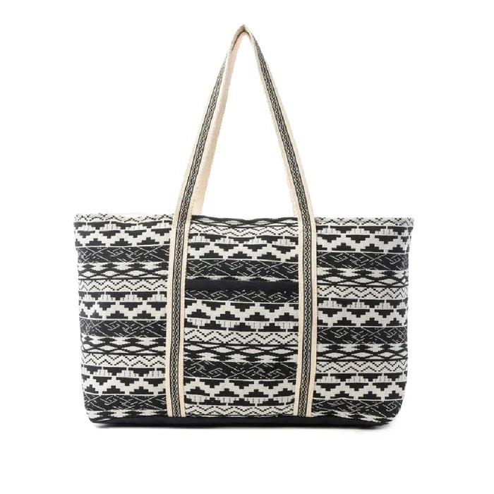A tote bag showcasing a classic black and white striped design.