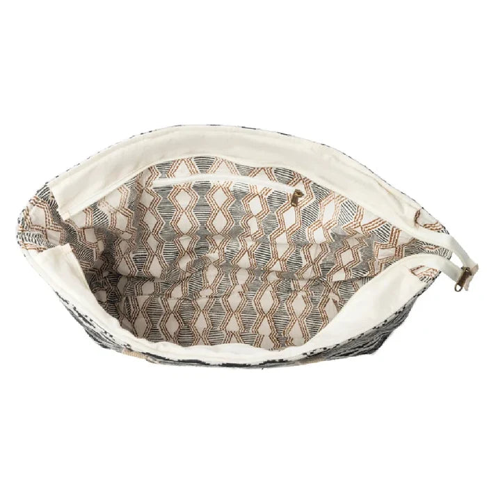 A tote bag adorned with striking black and white stripes.