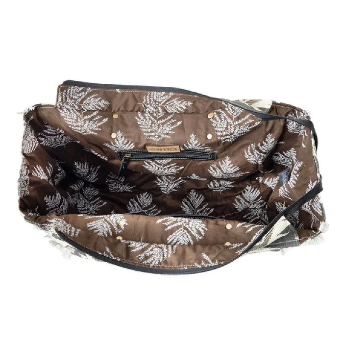 Generous tote bag displaying a unique black and white tribal print.