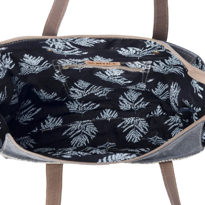 A large tote bag designed with cotton and linen fabric, perfect for stylishly transporting your belongings.