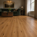 Natural Oak Prestige laminate flooring in a modern living room setting.