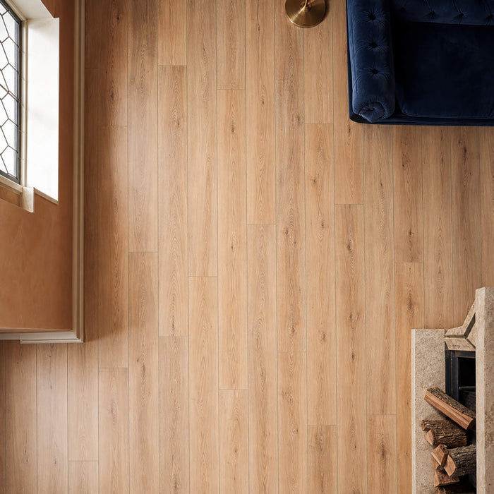 Elevated view of Natural Oak Rigid LVT flooring in a living room setting.
