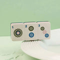 Whether you're hosting a mahjong gathering or looking for a unique decorative accent, this mini adds personality and style to your table.